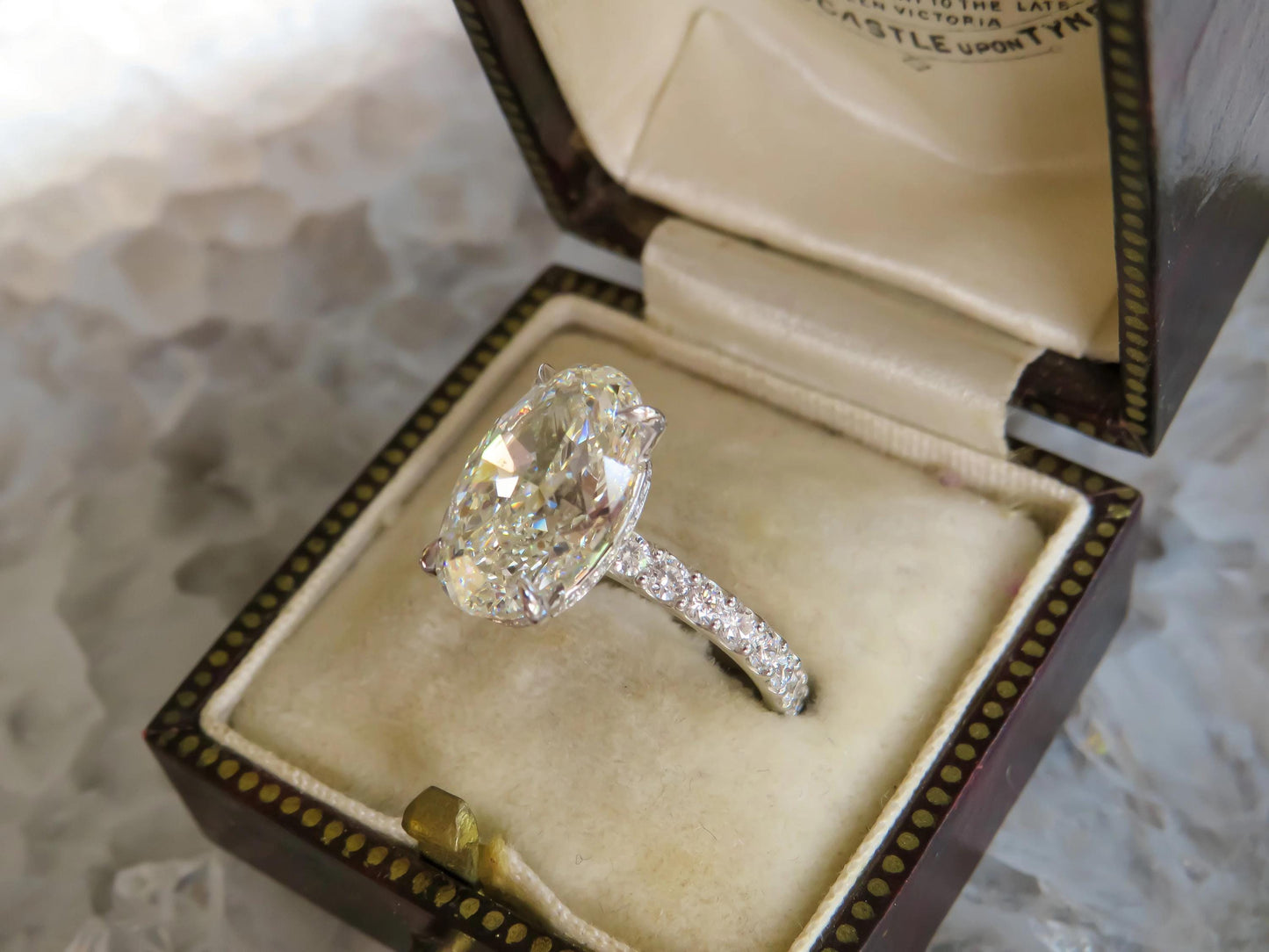 4.01 Carat GIA Certified Oval Diamond Ring in Platinum with Hidden Diamond Halo